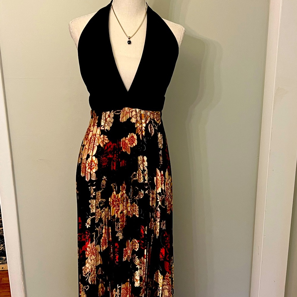 Beautiful halter gown with black built in bra halter top and pleated bottom.